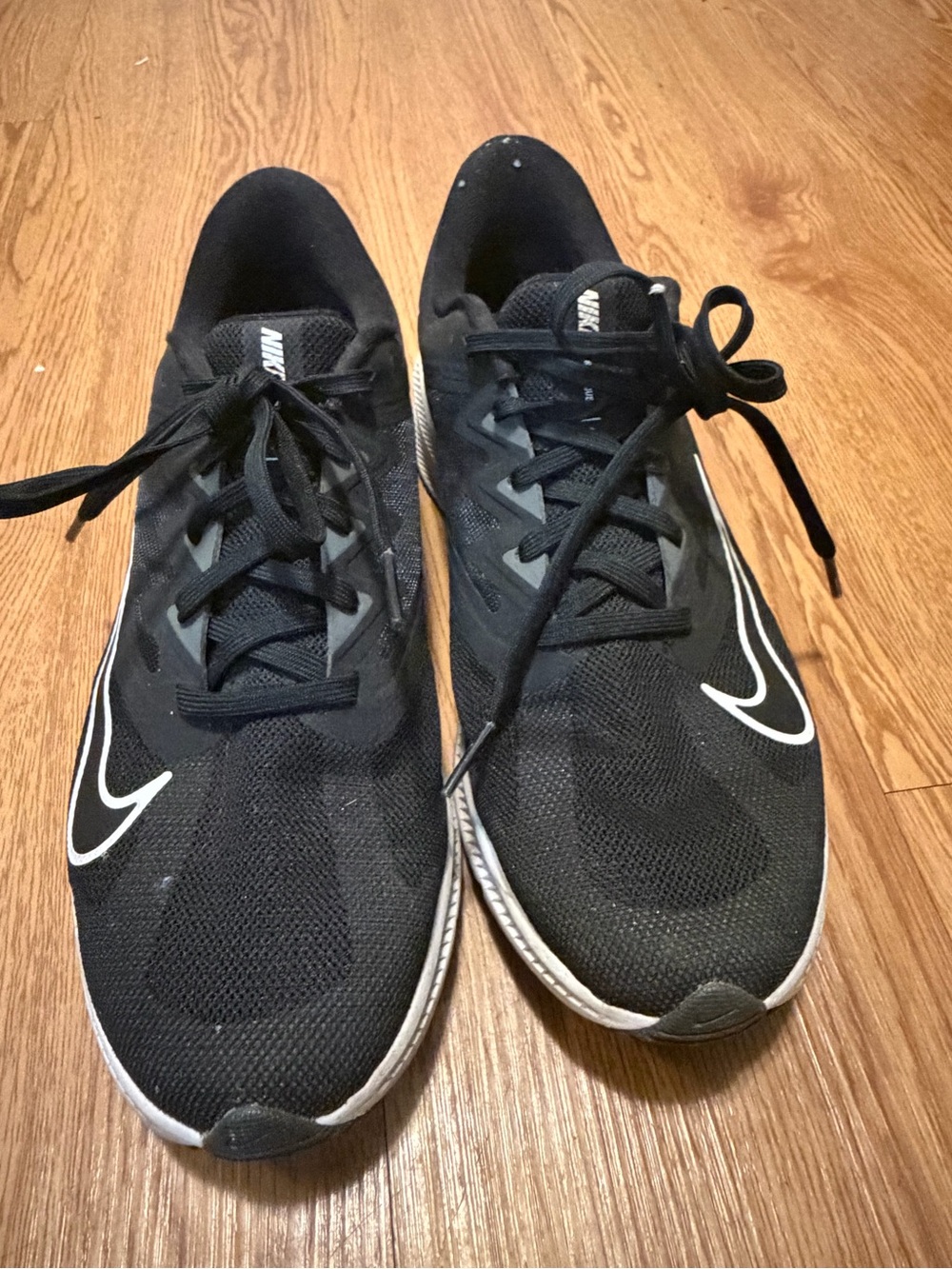 Nike women’s Black Running Shoes with White Swoosh